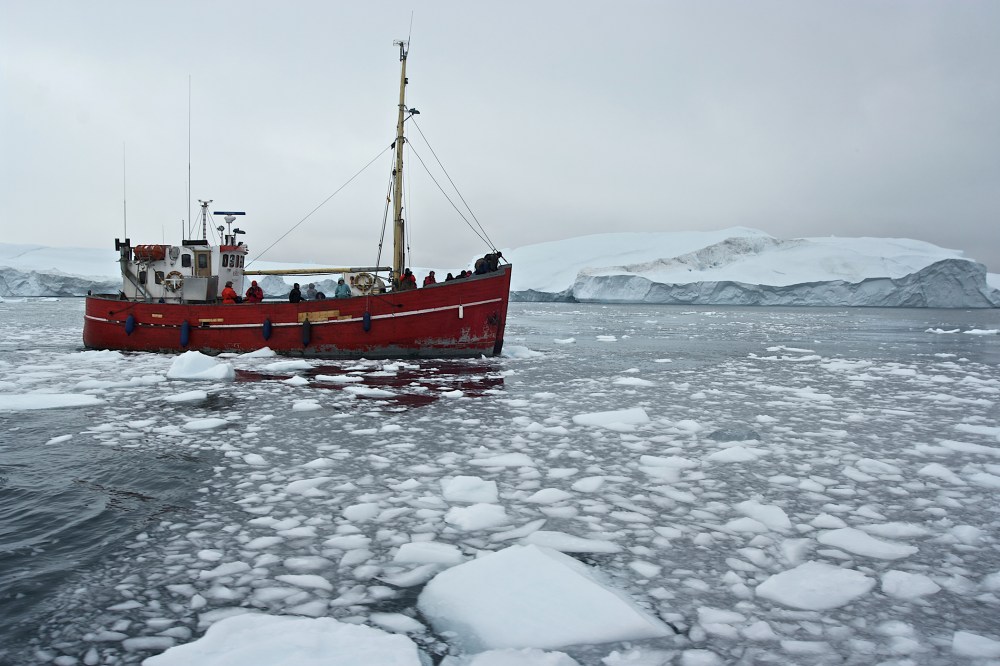 Ship among icebergs in Greenland. (Photo by DeAgostini/Getty)