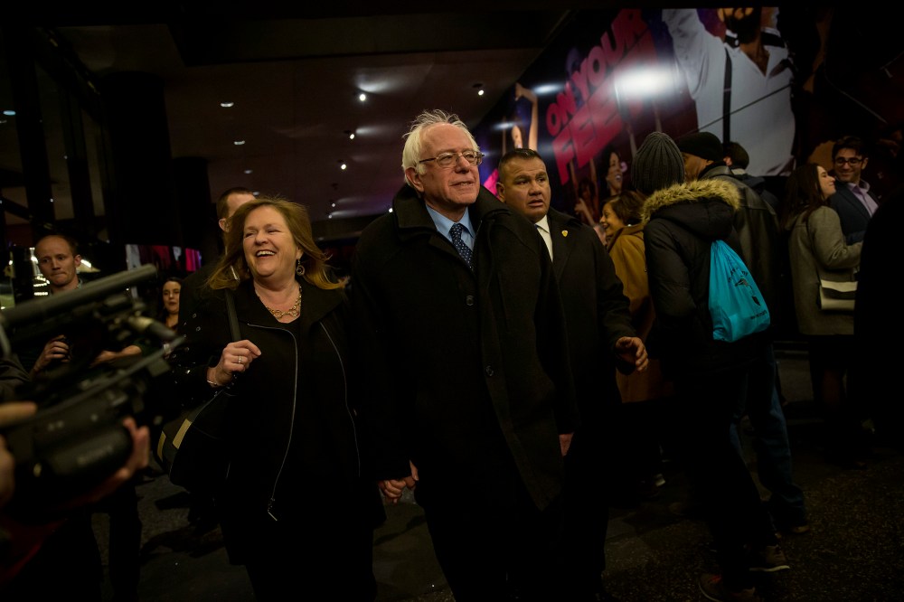 Democratic presidential candidate Sen. Bernie Sanders (D-VT) and his wife, Jane Sanders, walk through the Theatre District in Times Square, April 8, 2016 in New York City. (Photo by Eric Thayer/Getty)