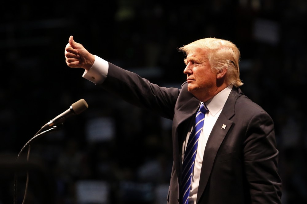 Republican presidential candidate Donald Trump gives a thumbs up to supporters after speaking at a campaign rally on April 11, 2016 in Albany, New York. (Photo by Eduardo Munoz Alvarez/Getty)