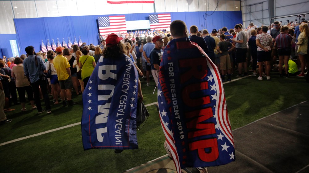 Supporters of Republican presidential nominee Donald Trump wear flag capes, Aug. 15, 2016, in Scranton, Pa. (Photo by Dominick Reuter/AFP/Getty)