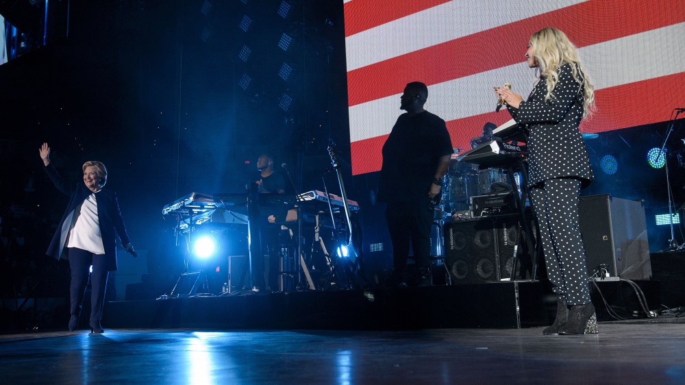 Beyonce watches as Democratic presidential nominee Hillary Clinton arrives during a performance in support of Democratic presidential nominee Hillary Clinton at the Wolstein Center, Nov. 4, 2016 in Cleveland, Ohio. (Photo by Brendan Smialowski/AFP/Getty)