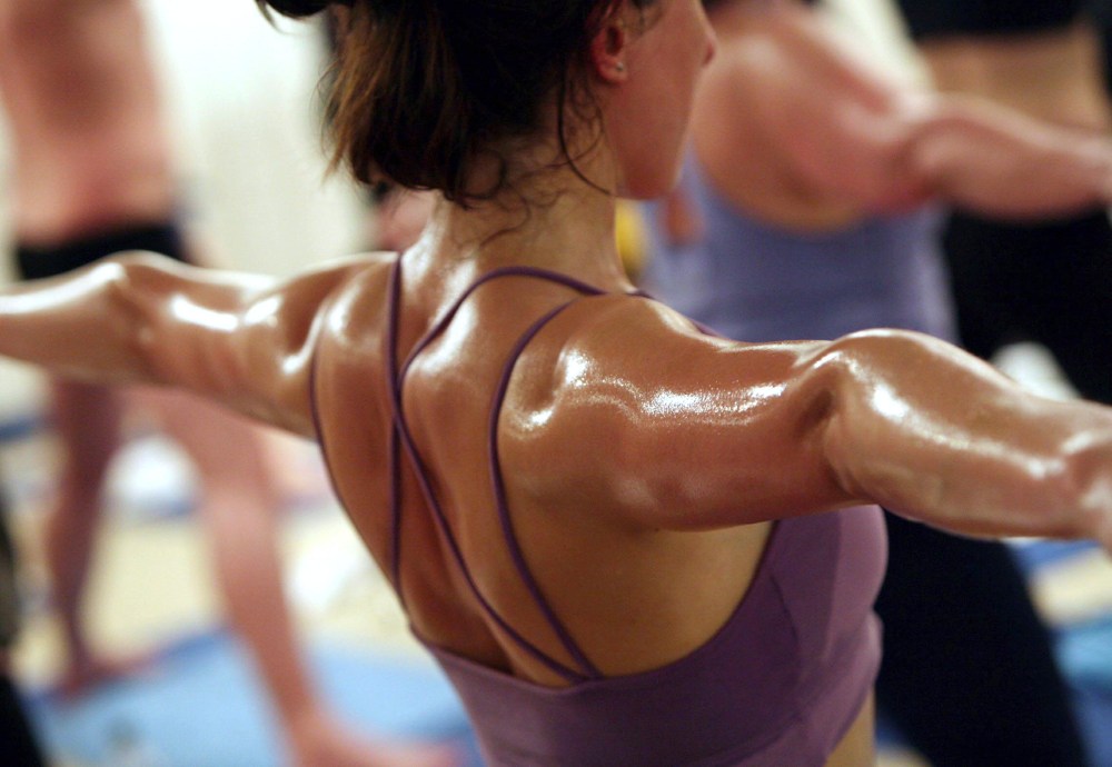 Students practice the unique Bikram Yoga at the City Studio, on March 13, 2007 in London, England. (Photo by Matt Cardy/Getty)