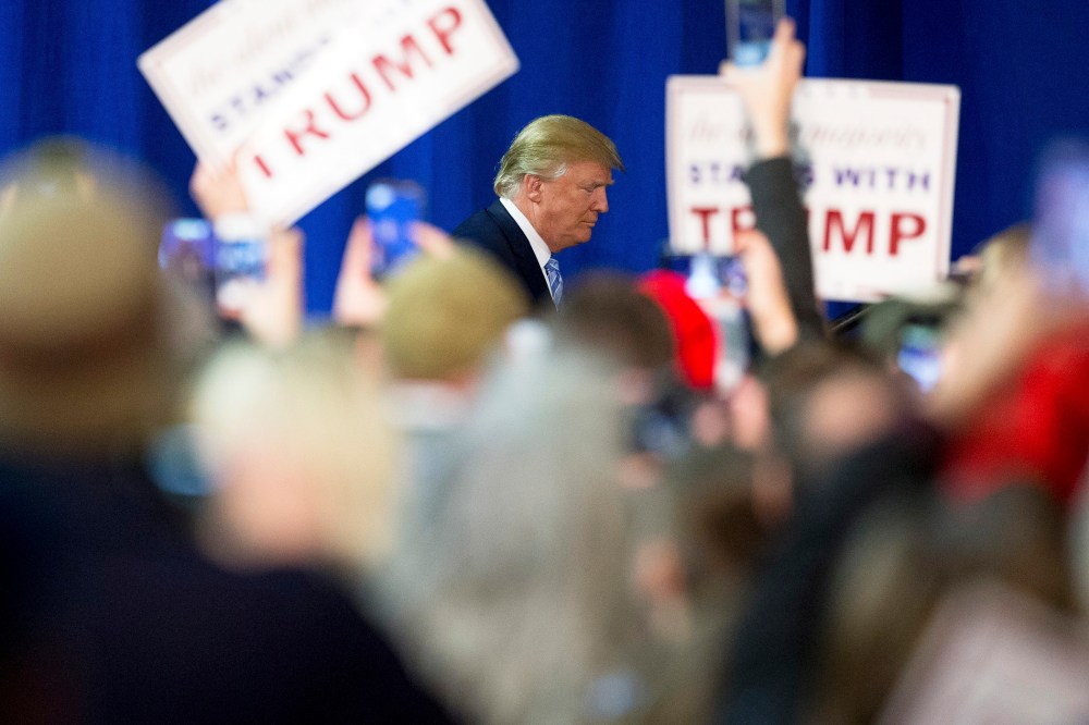 Republican presidential candidate Donald Trump arrives to speak at a rally at Muscatine High School in Muscatine, Iowa, Jan. 24, 2016. (Photo by Andrew Harnik/AP)