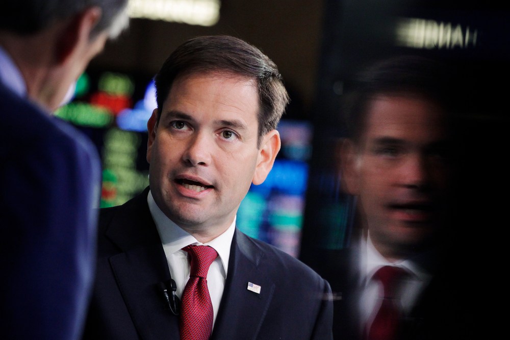 Republican presidential candidate, Sen. Marco Rubio, R-Fla., talks to CNBC correspondent John Harwood, left, during an interview at the New York Stock Exchange, Oct. 5, 2015. (Photo by Mark Lennihan/AP)