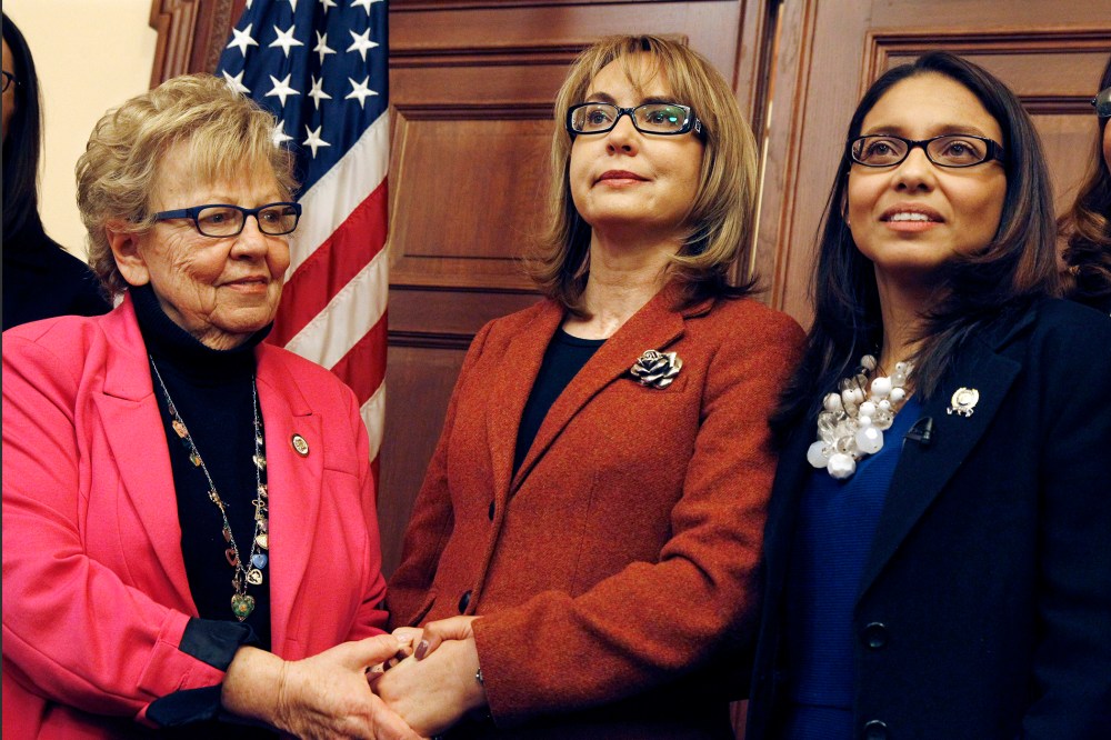 Former U.S. Rep. Gabrielle Giffords, center, of Arizona, poses for photographs with New Jersey Assemblywoman Gabriela Mosquera, right, D-Turnersville, N.J., and state Sen. Loretta Weinberg, left, D-Teaneck, N.J., after a meeting on March 18, 2015.