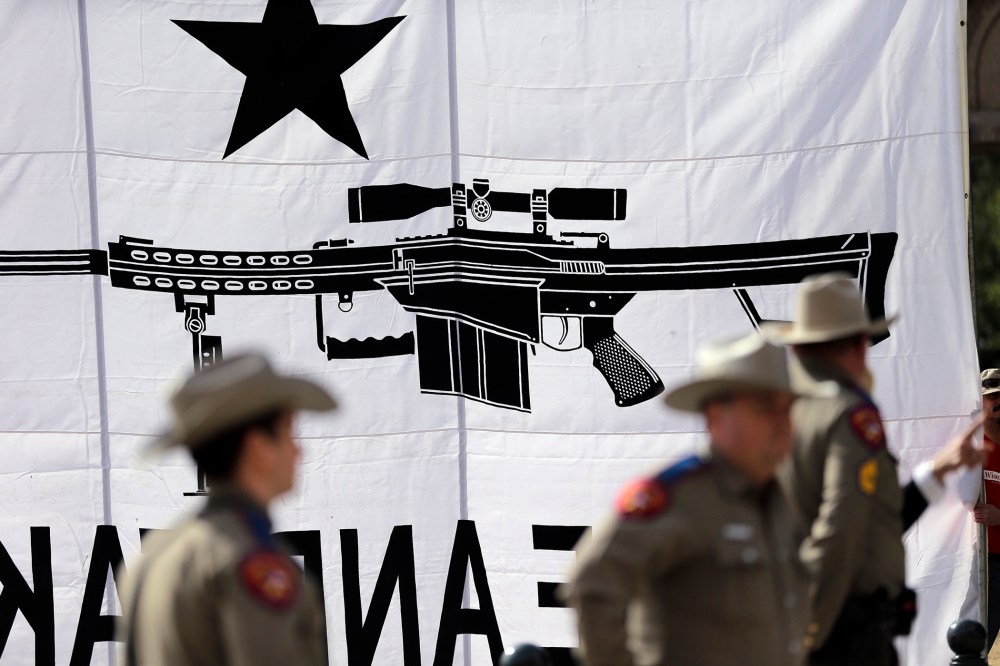 Texas State Troopers watch over a rally in support of open carry gun laws at the Capitol, on Jan. 26, 2015, in Austin, Texas.