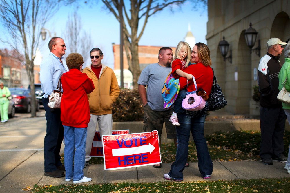 Voters line up at the Board of Elections office to cast their early ballots in New Philadelphia, Ohio, Oct. 26, 2012.