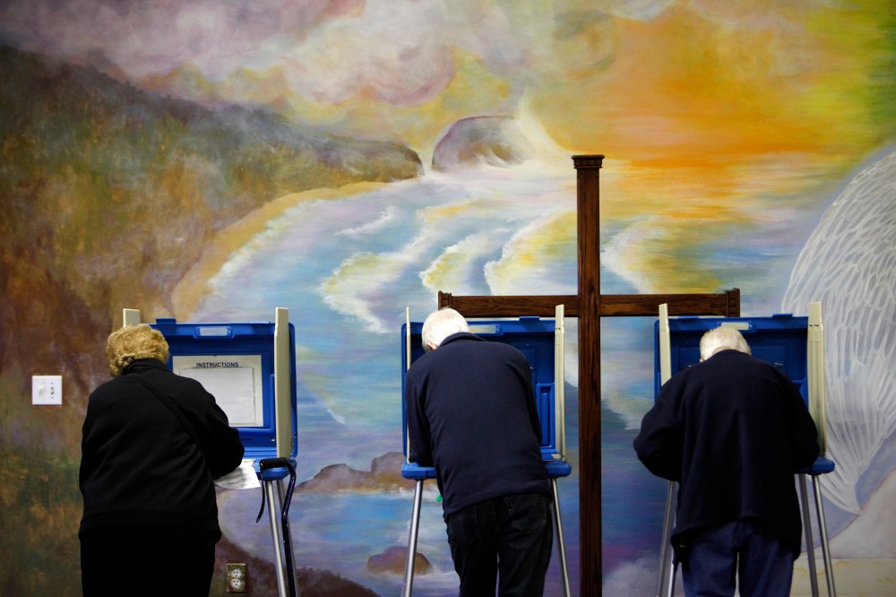 Voters cast ballots at the Fellowship of Christ church in Cary, N.C.