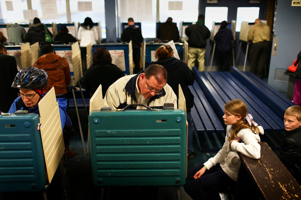 Randy Szerszen brings his two children, Grace and Luke, to a polling station in Cleveland, Ohio, on Election Day, Nov. 6, 2012. (Photo by Michael F. McElroy/The New York Times/Redux)