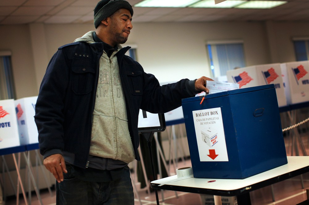 A voter drops off a provisional ballot at the Board of Elections in downtown Cleveland.