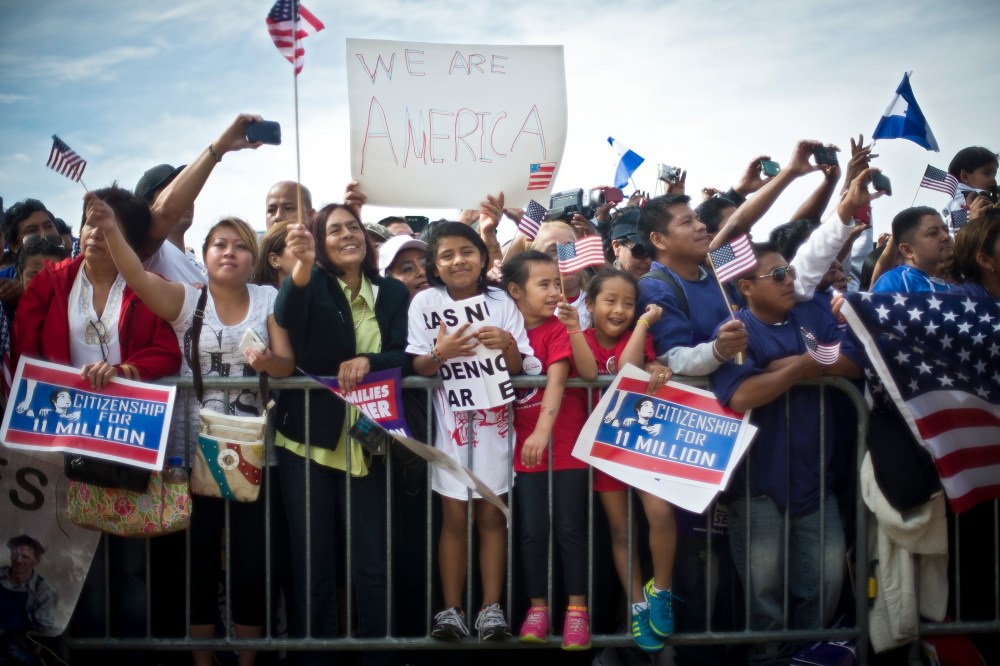 Immigration reform supporters cheer at a rally on the National Mall in Washington, Oct. 8, 2013.