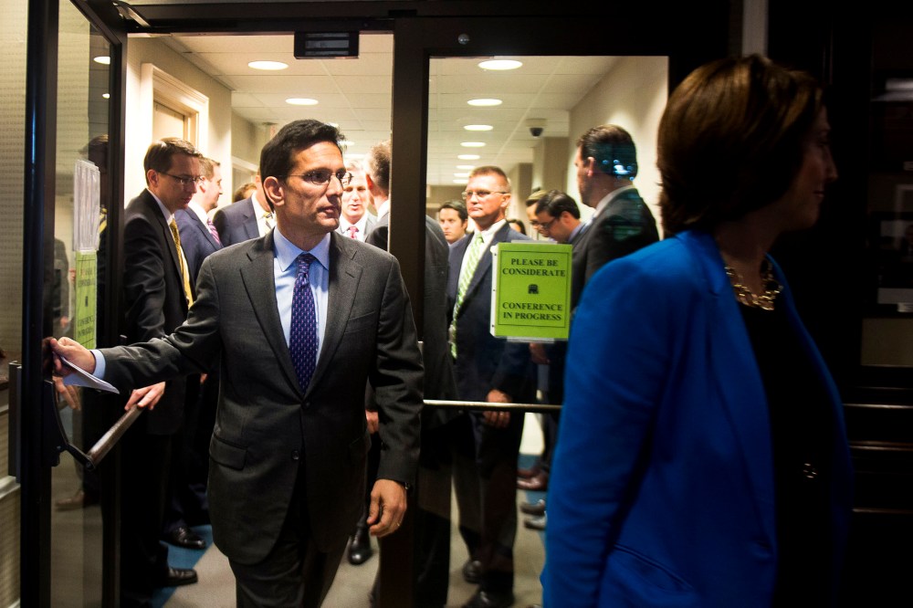 Eric Cantor enters a news conference at the Republican National Committee headquarters in Washington, Oct. 23, 2013.