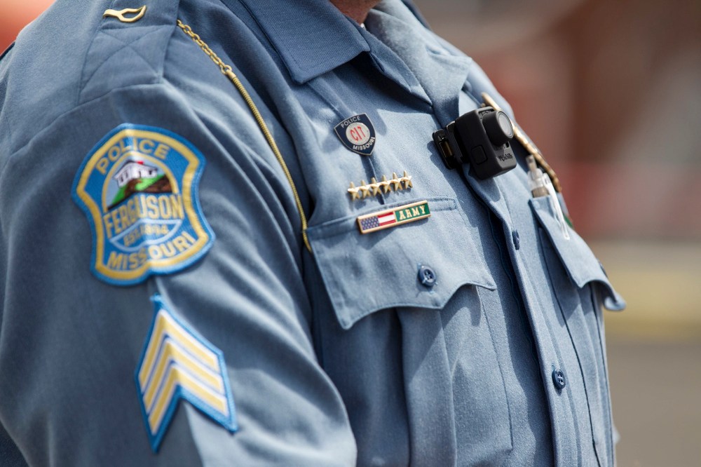 A Ferguson police officer wears a body camera during a news conference in Ferguson, Mo., Sept. 1, 2014.
