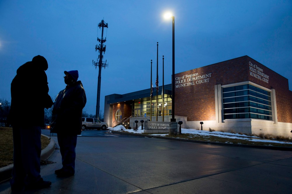 Protesters stand outside the Ferguson Police Department in Ferguson, Mo., March 3, 2015. (Photo by Whitney Curtis/The New York Times/Redux)