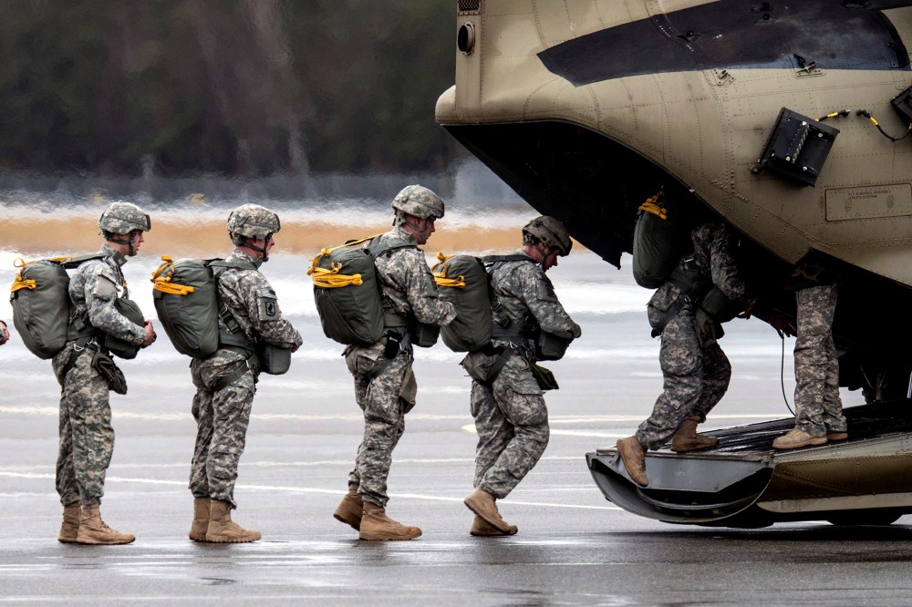 Paratroopers of the US Army enter a helicopter at the training area in Grafenwoehr, Germany on Feb. 10, 2014.
