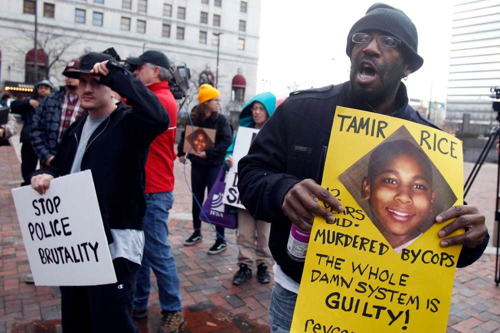 Protesters march during a rally at Public Square in Cleveland, Ohio on Nov. 24, 2014, following the November 22 fatal shooting of 12 year old Tamir Rice by a Cleveland Police officer. (Photo by David Maxwell/EPA)