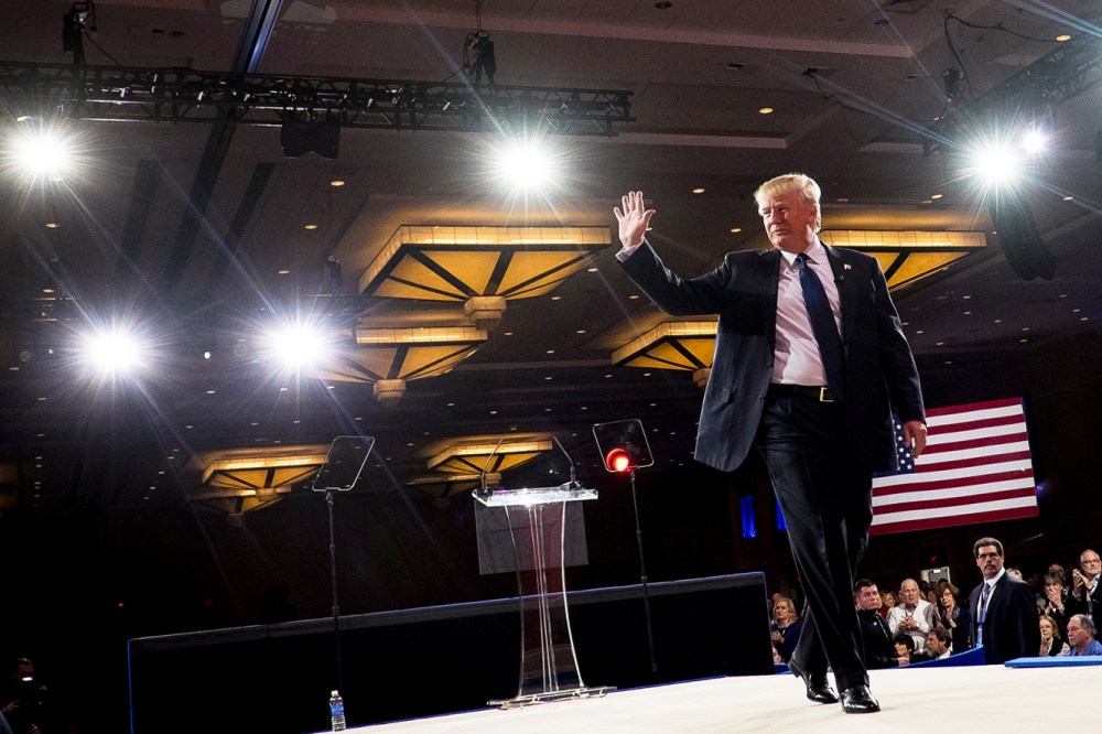 American businessman Donald Trump leaves the stage after addressing the American Conservative Union's 42nd Annual Conservative Political Action Conference (CPAC) in National Harbor, Md., on Feb. 27, 2015. (Photo by Pete Marovich/EPA)