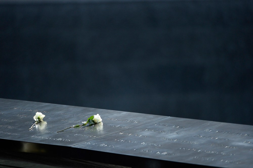 Roses sit on the edge of the south pool of the 9/11 Memorial in New York, N.Y., on Sept. 25, 2015. (Photo by CJ Gunther/EPA)