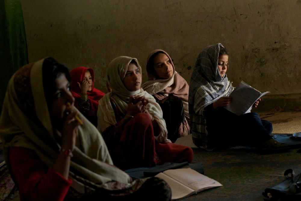 A group of conflict displaced Bajauri girls sit in a class in a UNICEF supported school in Risalpur, Pakistan in 2011.