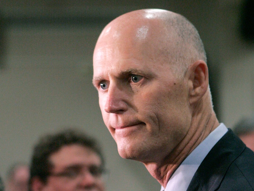 File Photo: Gov. Rick Scott expresses his disappointment about the supreme court's decision concerning the health care bill at a news conference on Thursday, June 28, 2012, in Tallahassee, Fla.   (Photo by Steve Cannon/AP Photo File)