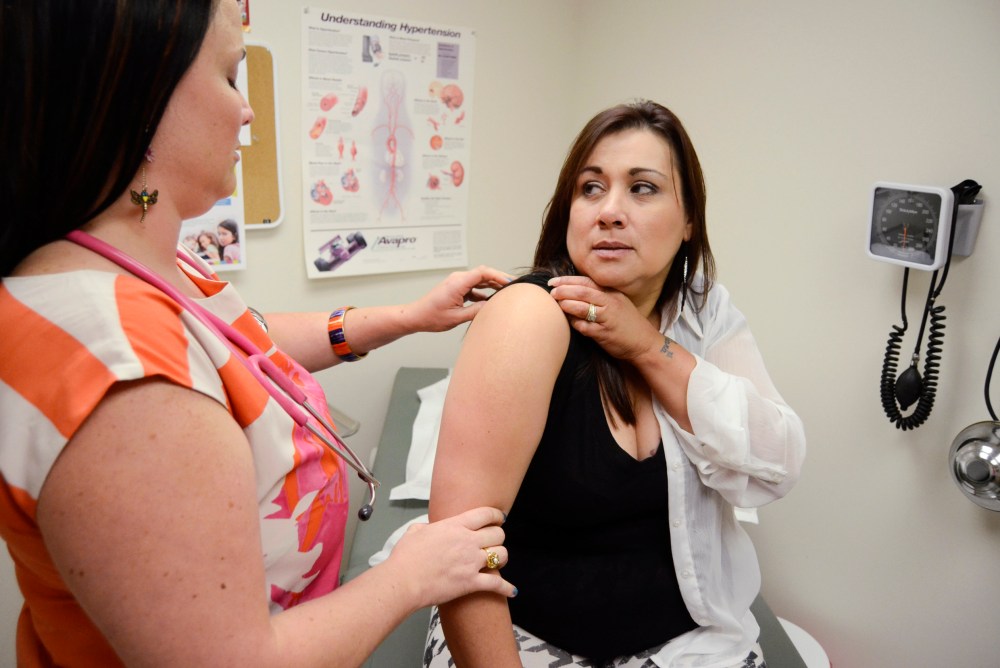 Chief Medical Officer, Rogena Johnson, M.D., left, at PrairieStar Health Center in Hutchinson, Kan., Sept. 25, 2013.