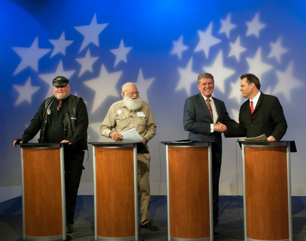 In this image provided by Idaho Public Television, Idaho Gov. Butch Otter, second right, appears on stage with Republican gubernatorial hopefuls, from left, Harley Brown, Walt Bayes, and state Sen. Russ Fulcher, at a debate Thursday May 15, 2014.