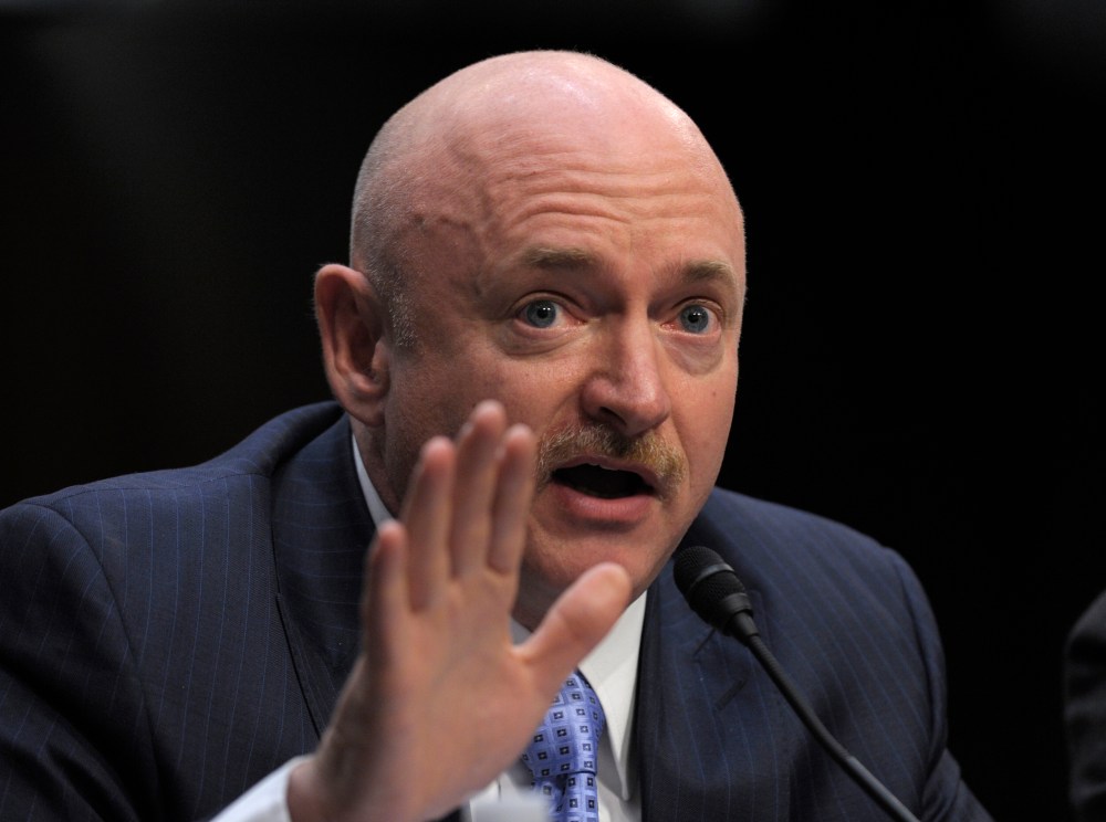 Mark Kelly, husband of former Arizona Rep. Gabrielle Giffords, who was seriously injured in the mass shooting that killed six people in Tucson, Ariz. two years ago, testifies on Capitol Hill in Washington, Wednesday, Jan. 30, 2013, before the Senate...