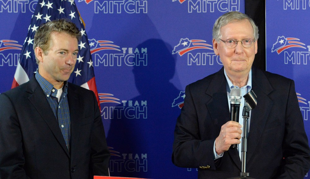 Kentucky Senators Mitch McConnell, left, and Rand Paul address the media during a press conference, May 23, 2014, in Louisville, Ky.