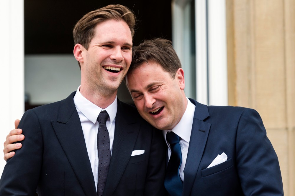Luxembourg's Prime Minister Xavier Bettel, right, puts his hand around the shoulder of his partner Gauthier Destenay after their marriage at the town hall in Luxembourg, on May 15, 2015. (Photo by Geert Vanden Wijngaert/AP)