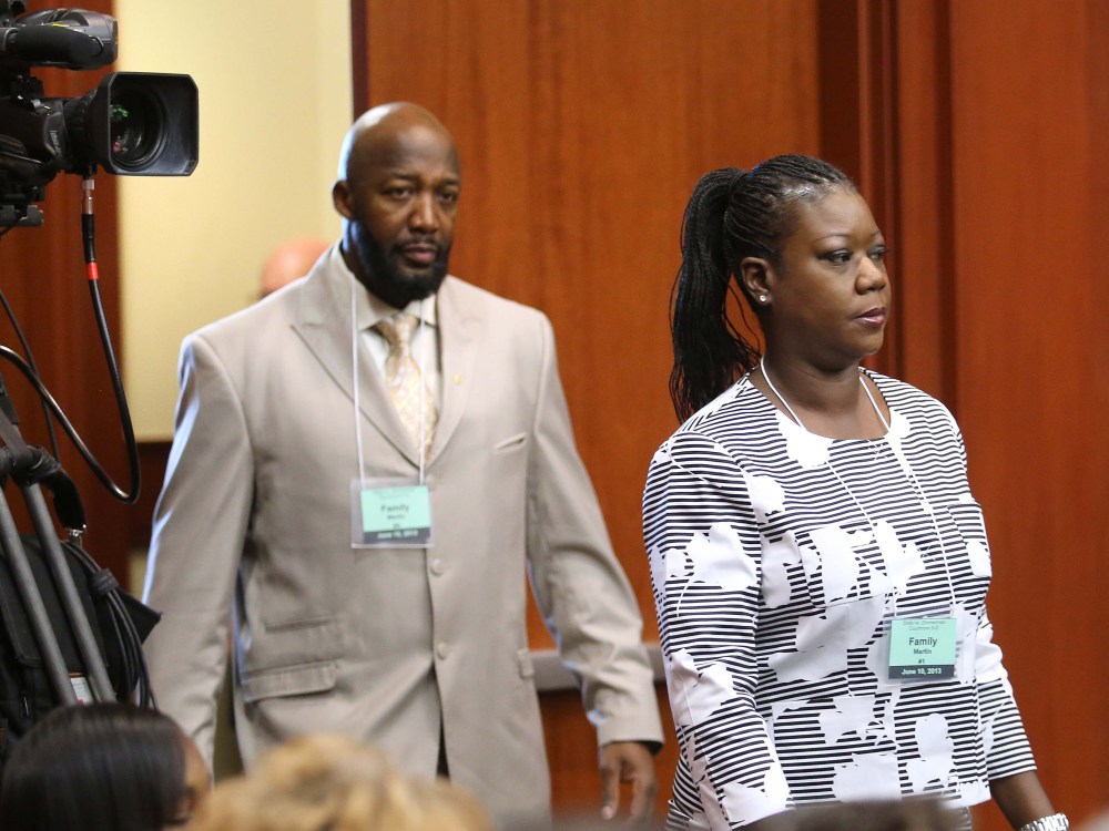 Tracy Martin, left, and Sybrina Fulton, parents of Trayvon Martin, arrive in court for the first day of the trial of George Zimmerman, in Seminole circuit court in Sanford, Fla., on June 10, 2013. (AP Photo/Orlando Sentinel, Joe Burbank/Pool)