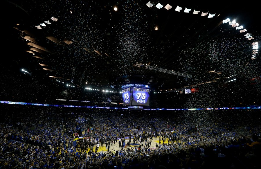 Confetti falls after the Golden State Warriors beat the Memphis Grizzlies 125-104 in an NBA basketball game in Oakland, Calif., April 13, 2016. (Photo by Jeff Chiu/AP)