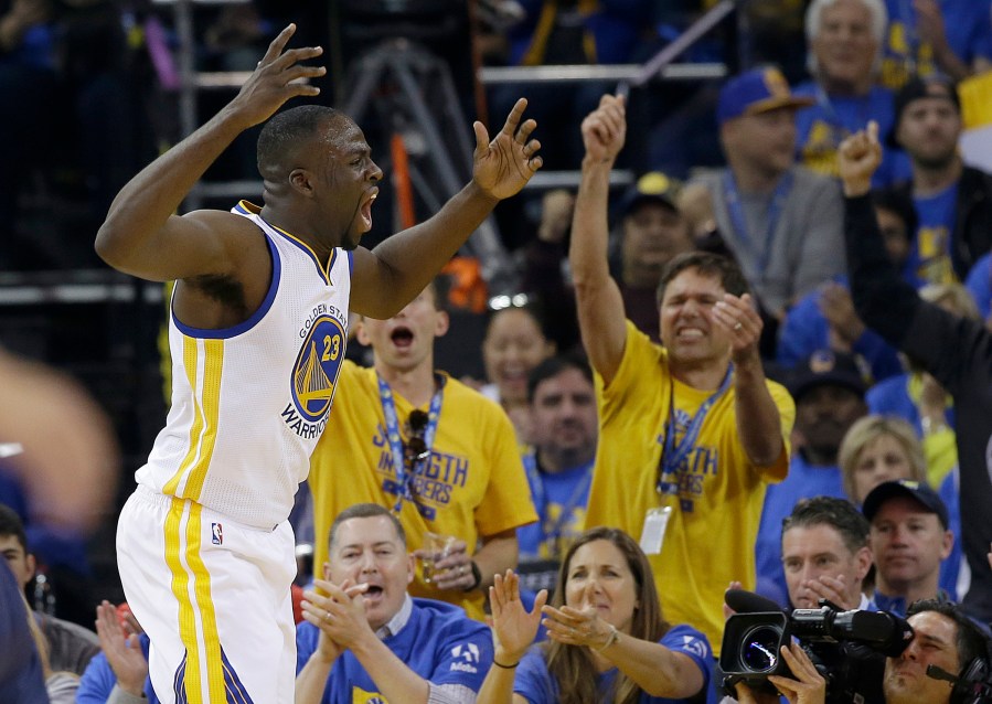 Golden State Warriors forward Draymond Green reacts in front of fans during the first half of an NBA basketball game against the Memphis Grizzlies in Oakland, Calif., April 13, 2016. (Photo by Marcio Jose Sanchez/AP)