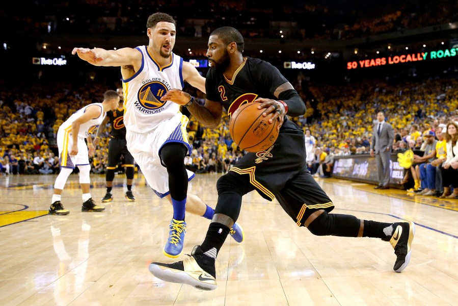Kyrie Irving #2 of the Cleveland Cavaliers drives with the ball against Klay Thompson #11 of the Golden State Warriors in Game 7 of the 2016 NBA Finals at ORACLE Arena on June 19, 2016 in Oakland, Calif. (Photo by Ezra Shaw/Getty)