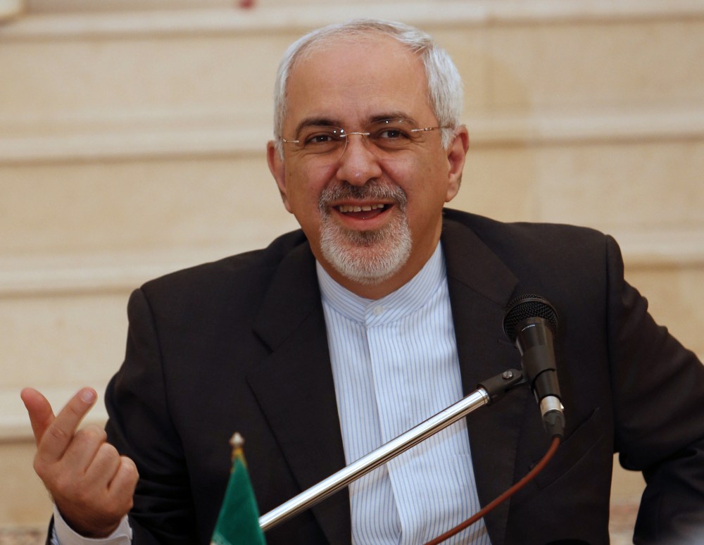 Iranian Foreign Minister Mohammed Javad Zarif holds a press conference at the Iranian embassy in Muscat following meetings with Omani officials on December 2, 2013.