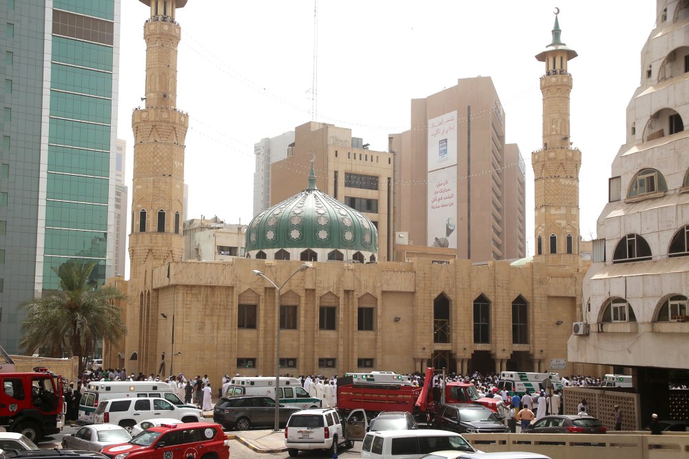 Kuwaiti security forces and emergency personnel gather outside the Shiite Al-Imam al-Sadeq mosque after it was targeted by a suicide bombing during Friday prayers on June 26, 2015, in Kuwait City. (Photo by Yasser Al-Zayyaty/AFP/Getty)