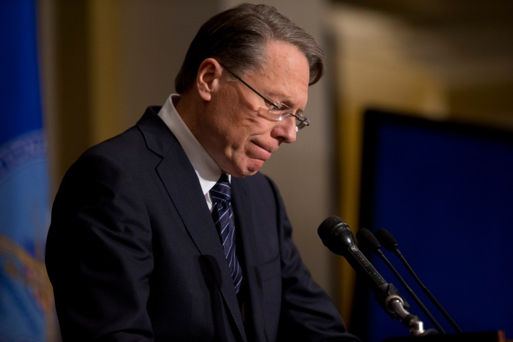 File Photo: National Rifle Association executive vice president Wayne LaPierre pauses as he makes a statement during a news conference in response to the Connecticut school shooting, on Friday, Dec. 21, 2012 (Photo by Evan Vucci/AP)