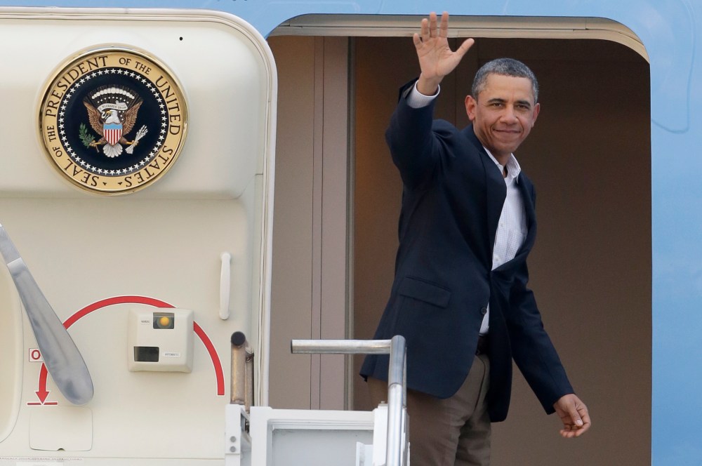 President Barack Obama waves from Air Force One as he leaves Palm Beach International Airport, Monday, Feb. 18, 2013. Obama spent the long Presidents Day weekend playing golf. (AP Photo/Wilfredo Lee)