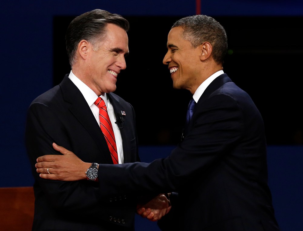 Republican presidential nominee Mitt Romney and President Barack Obama shake hands during the first presidential debate at the University of Denver, Wednesday, Oct. 3, 2012, in Denver. (AP Photo/Charlie Neibergall)