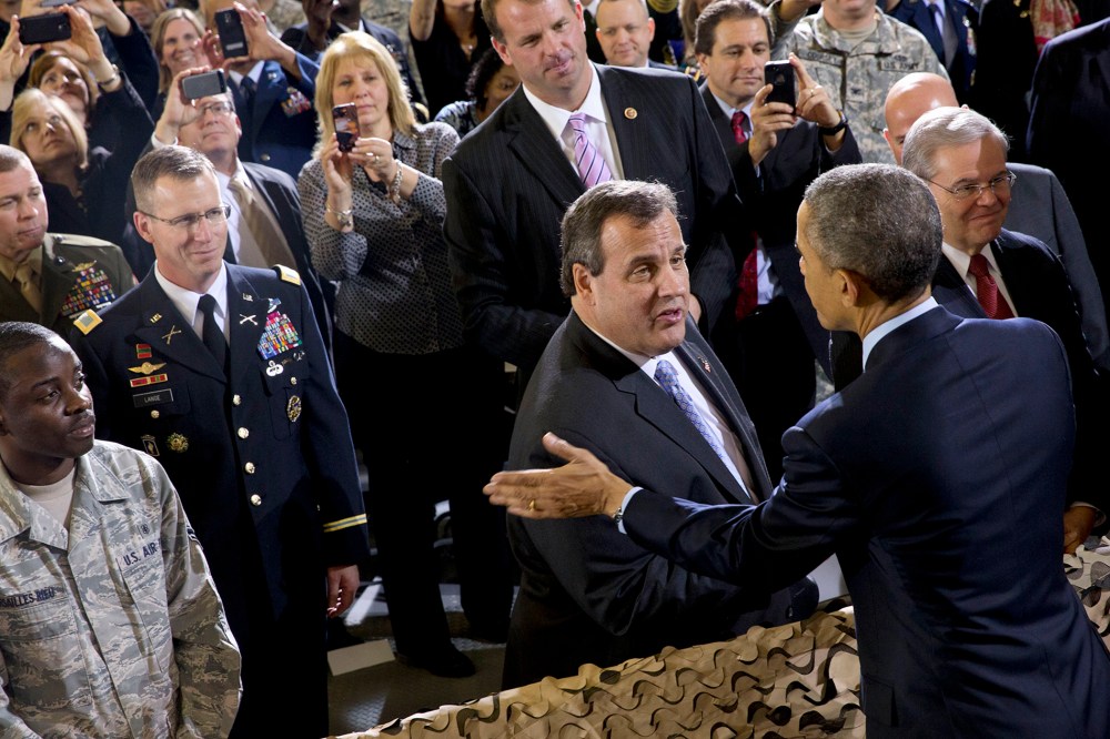 President Barack Obama talks with New Jersey Gov. Chris Christie after speaking to troops at Joint Base McGuire-Dix-Lakehurst, N.J. on Dec. 15, 2014. (Jacquelyn Martin/AP)