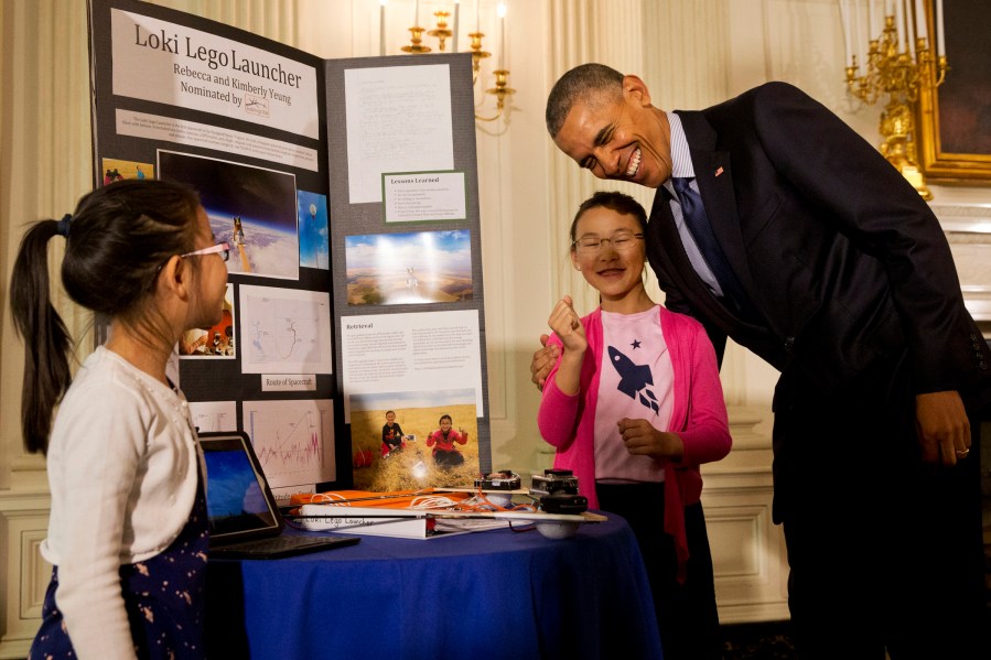 Barack Obama, Rebecca Yeung, Kimberly Yeung (Photo by Jacquelyn Martin/AP)