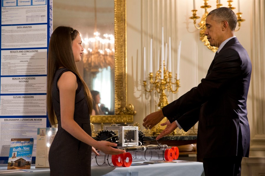 Hannah Herbst, 15, of Boca Raton, Fla., shows her invention, BEACON, an ocean-energy probe prototype to President Barack Obama during the 2016 White House Science Fair in the State Dining Room of the White House in Washington(Photo by Jacquelyn Martin/AP)