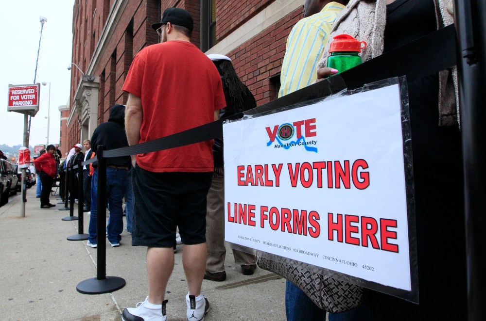 Voters stand in line outside the Hamilton County Board of Elections waiting to vote early in Ohio. Those voters will now be able to vote early on the three days before Election Day, thanks to the U.S. Supreme Court's refusal to block a lower court...