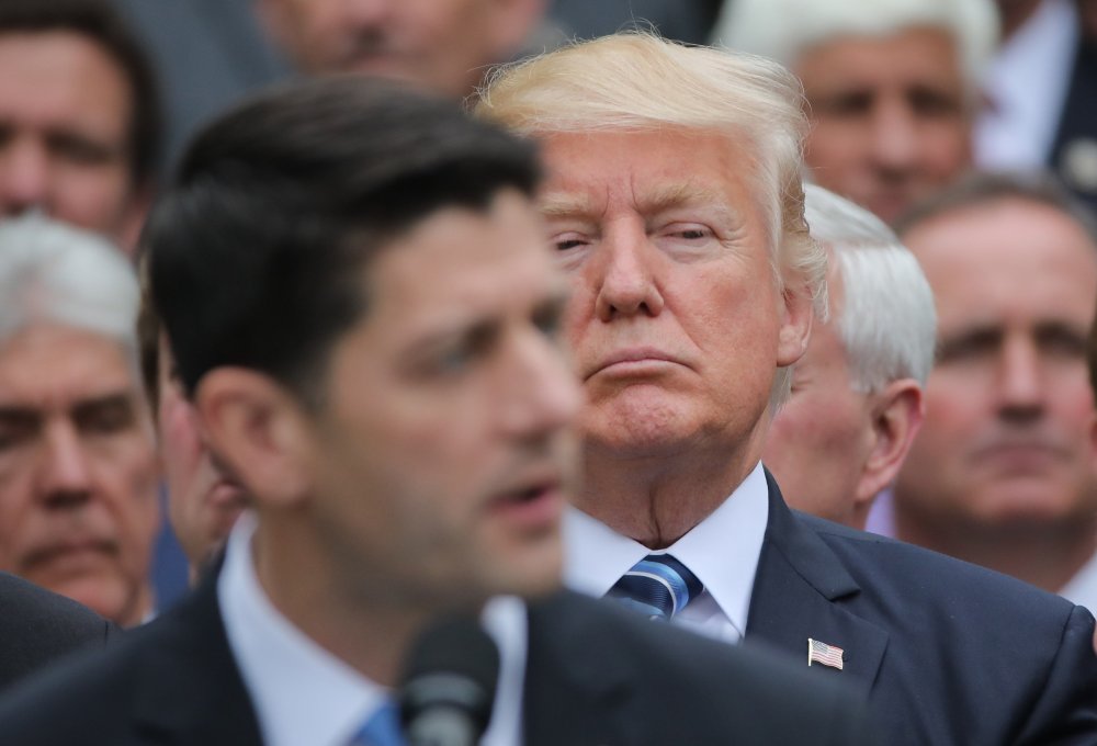 Image: U.S. President Trump listens to Speaker Ryan as he gathers with Republican House members after healthcare bill vote at the White House in Washington
