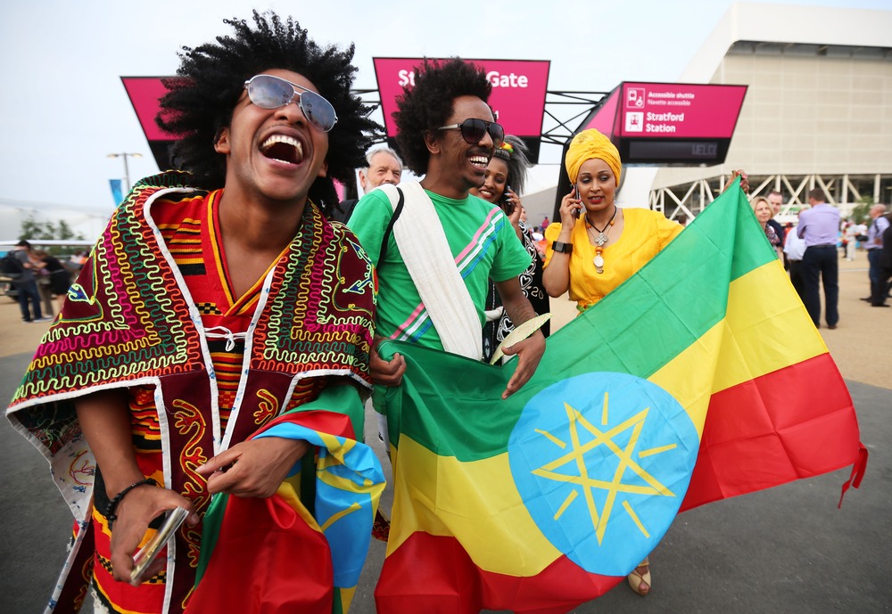 Fans of Ethiopia enjoy the atmosphere outside the Olympic stadium before the opening ceremony on July 27, in London.