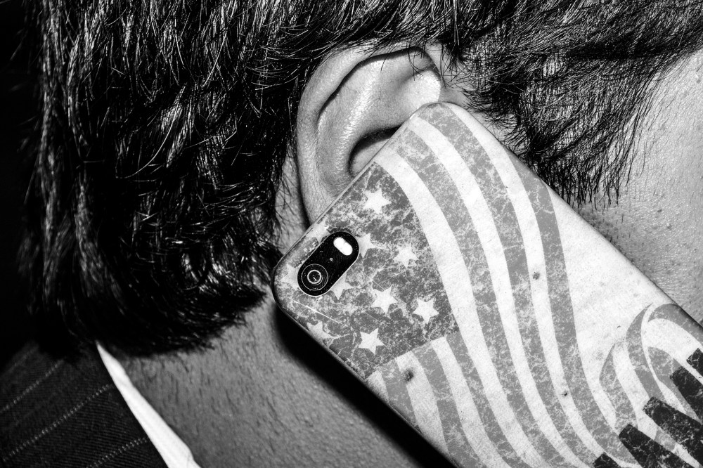 A guest uses his cell phone at The Conservative Political Action Conference, March 7, 2014, in National Harbor, Md.