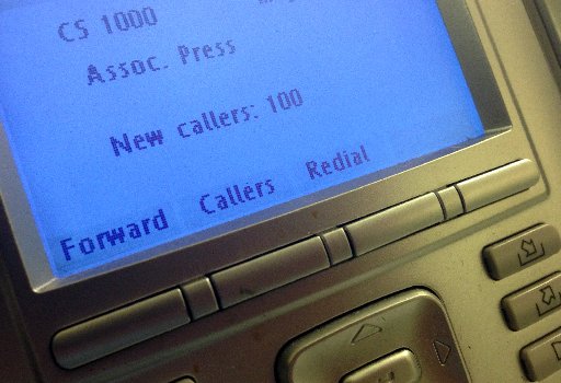 The screen on the phone console at the reception desk at The Associated Press Washington bureau, Monday, My 13, 2013. (AP Photo/Jon Elswick)