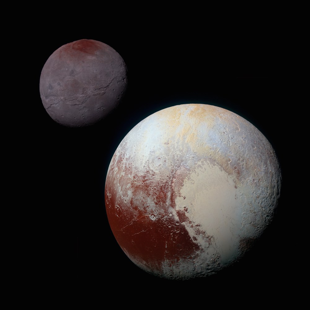 A composite of enhanced color images of Pluto (lower right) and Charon (upper left), taken by NASA's New Horizons spacecraft as it passed through the Pluto system on July 14, 2015.