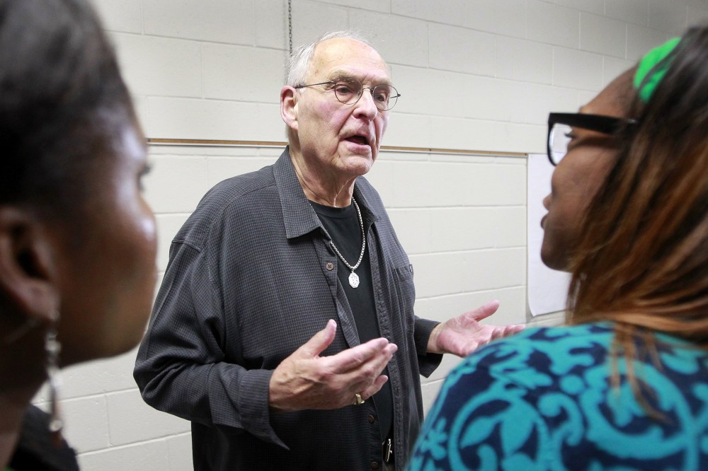 Wolfeboro Police Commissioner Robert Copeland is confronted by Whitney White, right, and Elizabeth Smith after a meeting on May 15, 2014 in Wolfeboro, N.H.