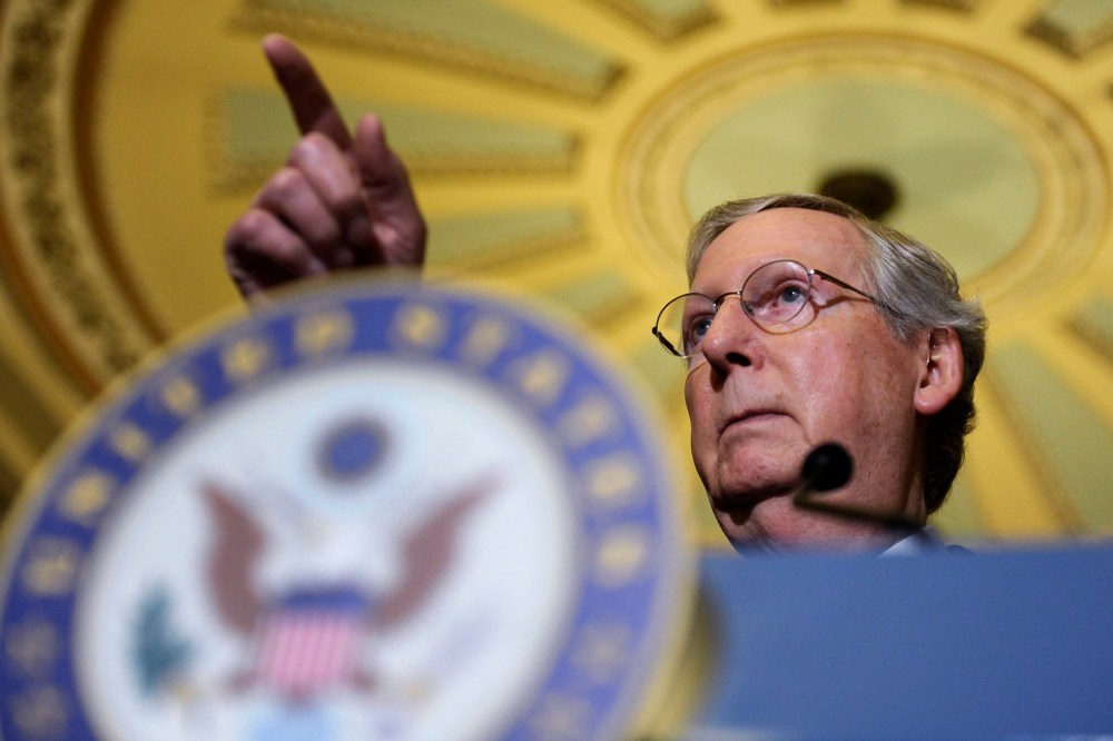 Mitch McConnell speaks to reporters during a news conference on Capitol Hill, Dec. 10, 2013.