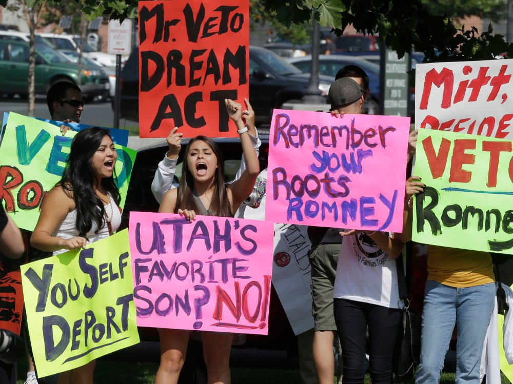 Immigration activists protest outside of The Grand America in Salt Lake City, Utah, where Republican presidential candidate and former Massachusetts Gov. Mitt Romney is holding a campaign fundraising event, Tuesday, Sept. 18, 2012.  (Photo by Charles...